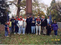 SUV members and friends posing in front of JC McCoy Momument at the Graves Registration Award Ceremony in Greenlawn Cemetery, Columbus Ohio.